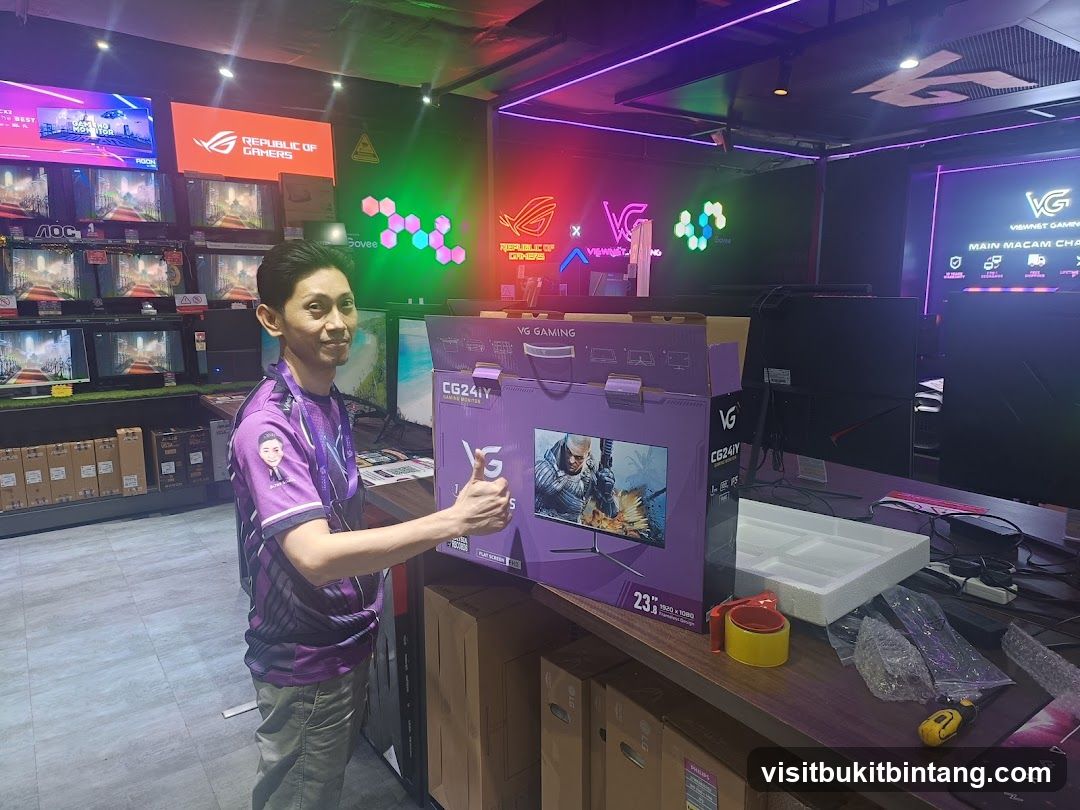 Man holding a computer monitor box