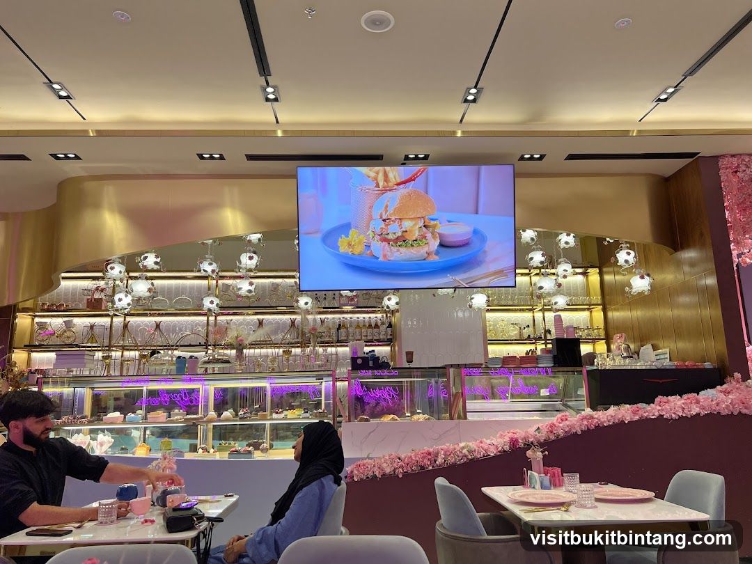 Cafe Interior with Display Cases and Digital Menu