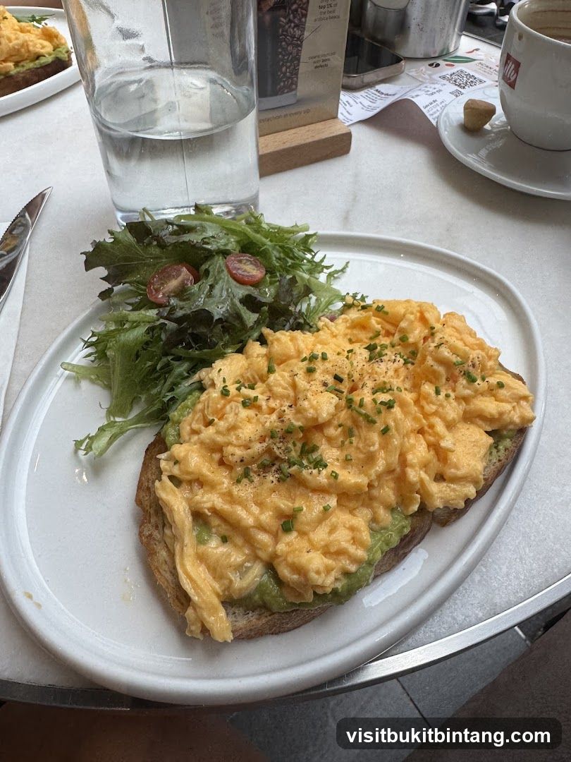 Scrambled Eggs on Toast with Avocado and Salad