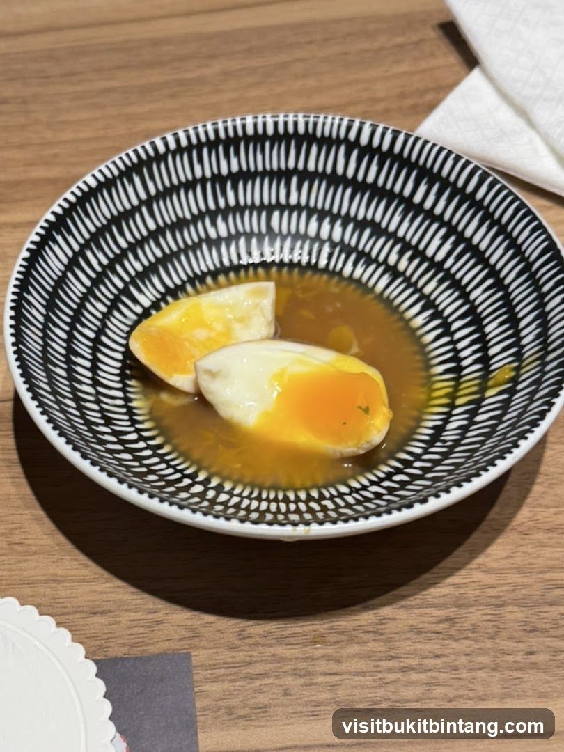 Soft-boiled eggs in broth