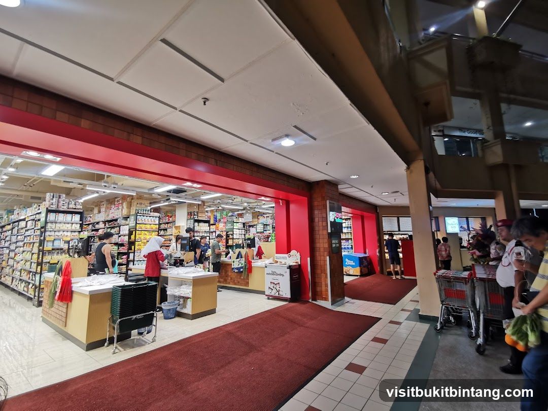 Interior of a grocery store with shoppers and staff