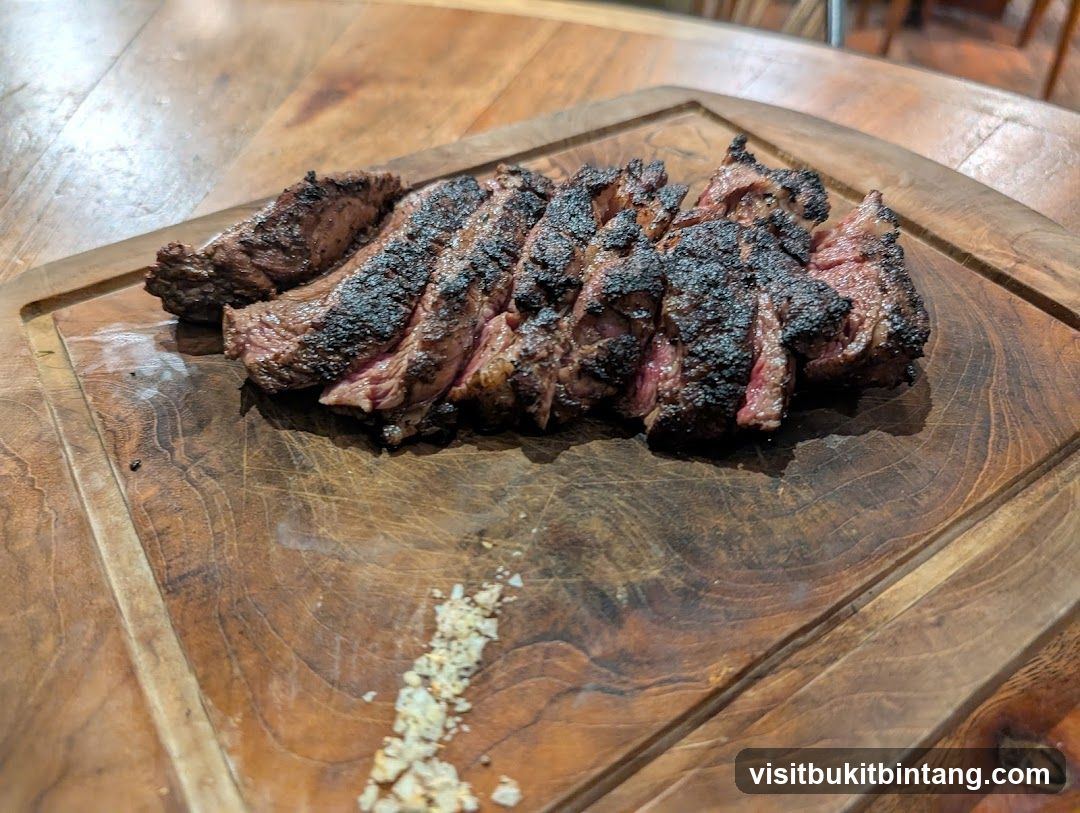 Sliced Steak on Wooden Board