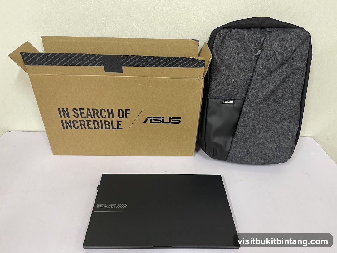 ASUS Laptop, Backpack, and Box