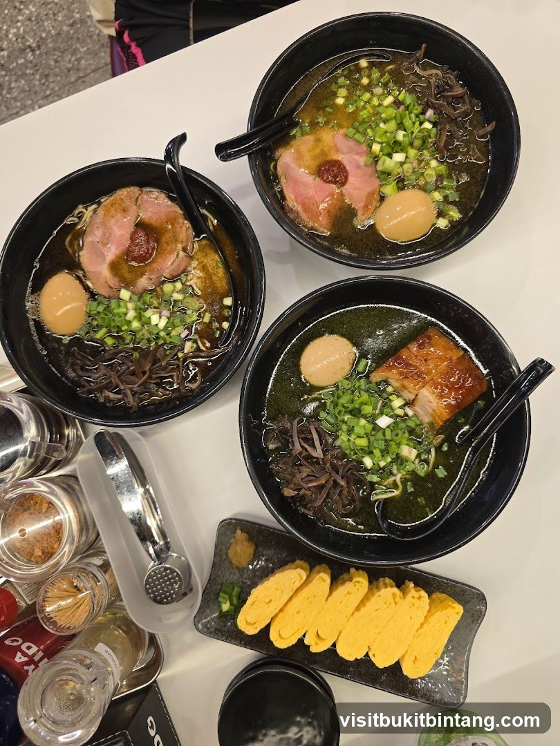 Three bowls of ramen and tamagoyaki
