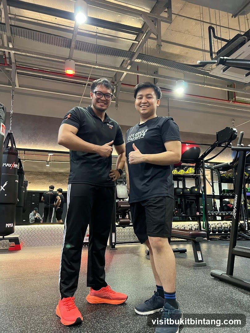 Two men posing in a gym