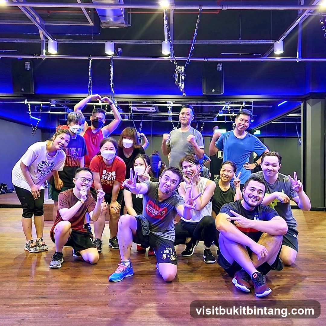 Group posing for a photo in a gym