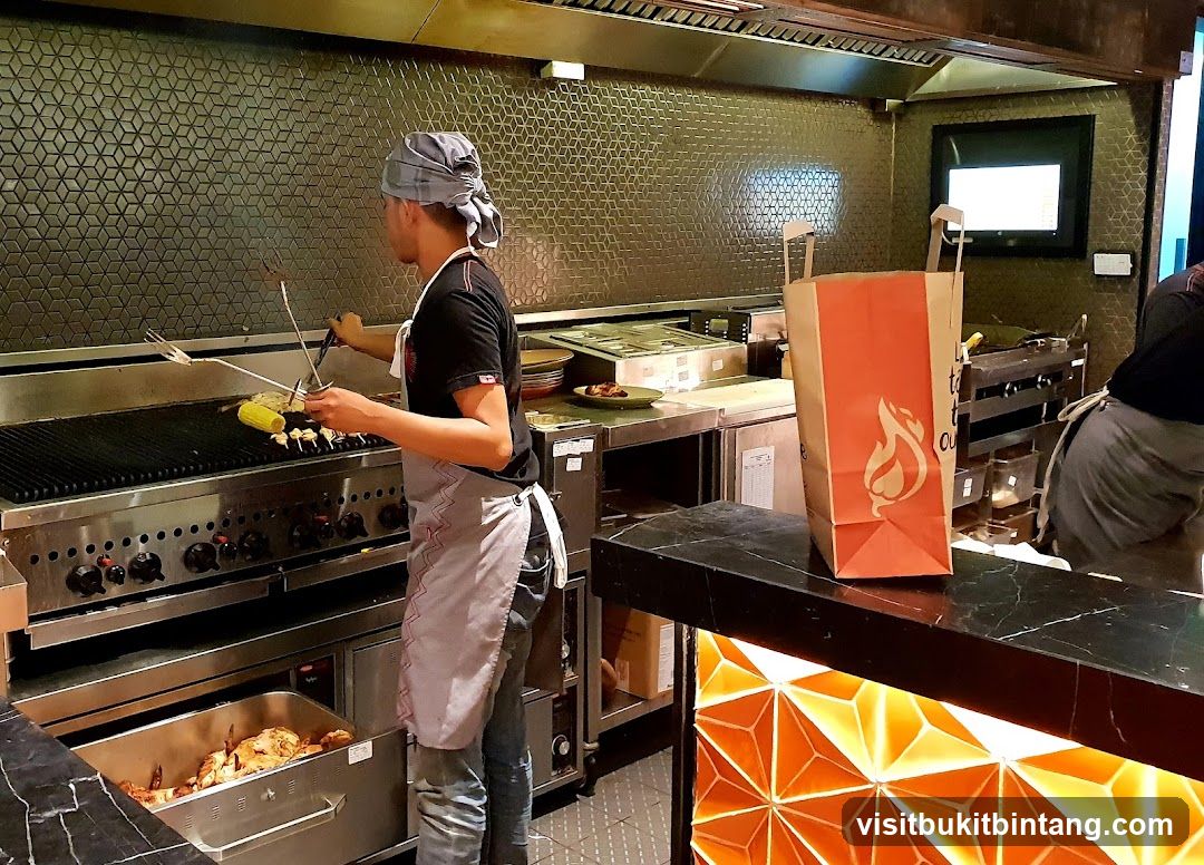 Kitchen Staff Grilling Food