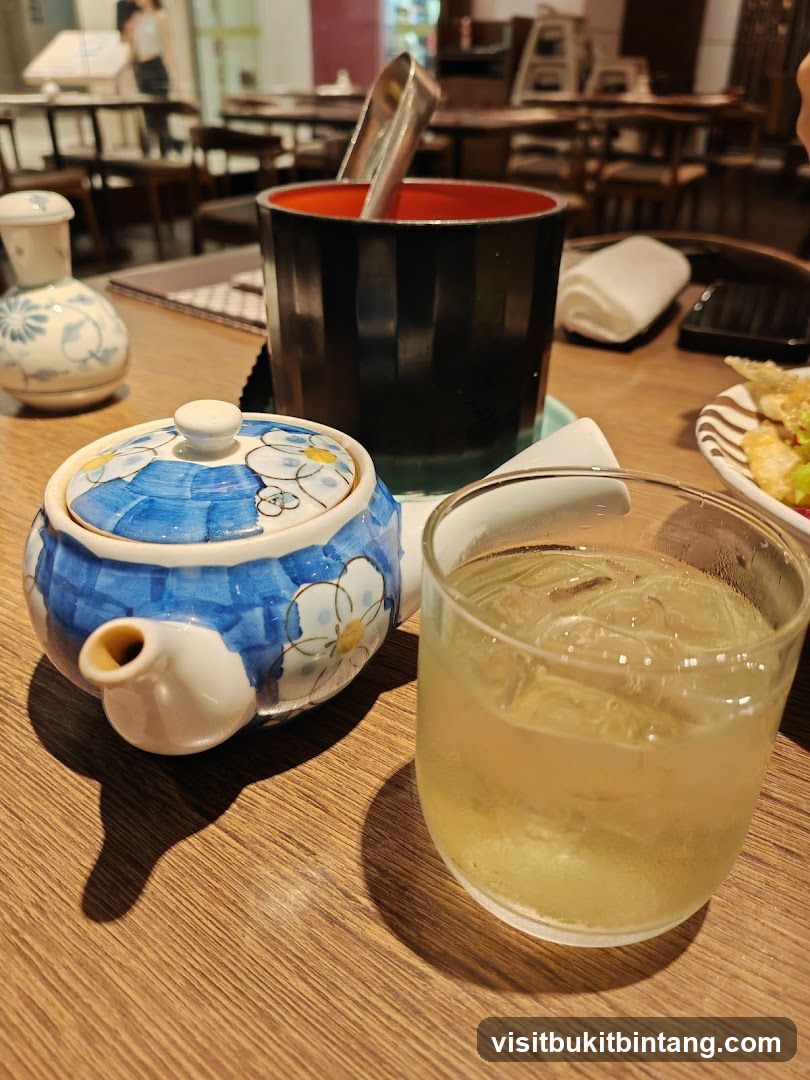 Table Setting with Teapot and Drink