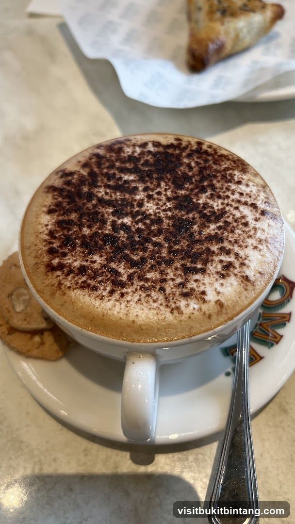 Cappuccino with cookies and pastry
