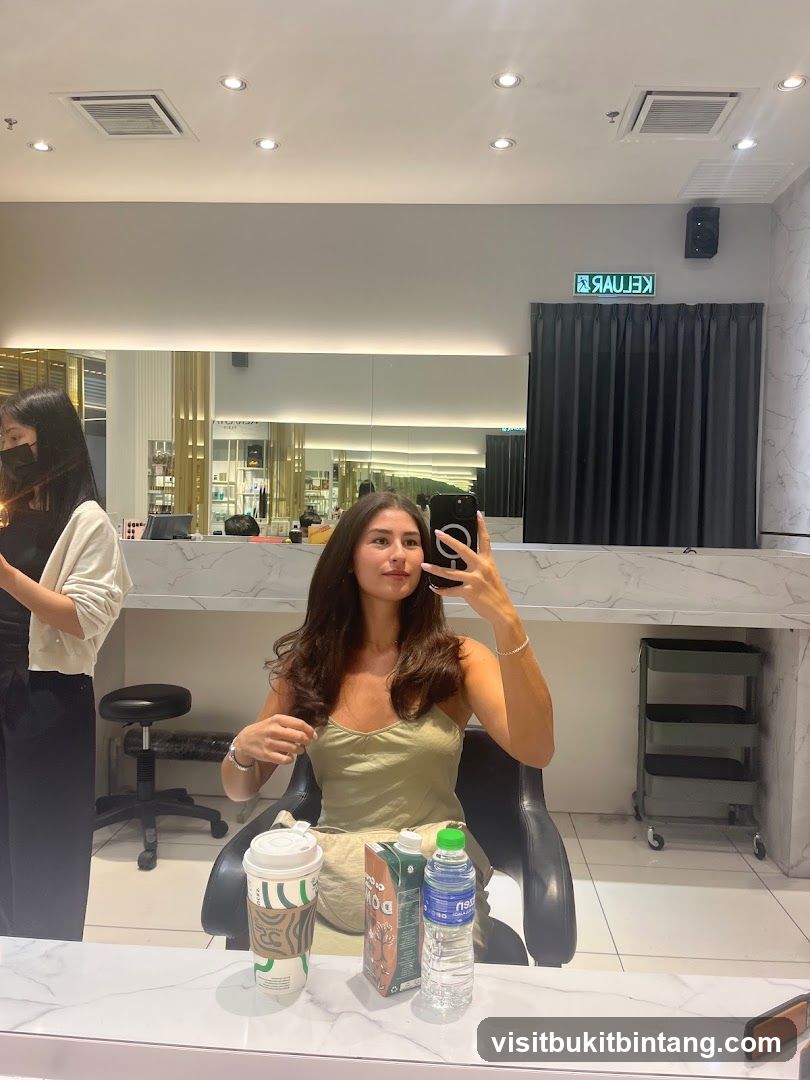 Woman taking a selfie in a salon