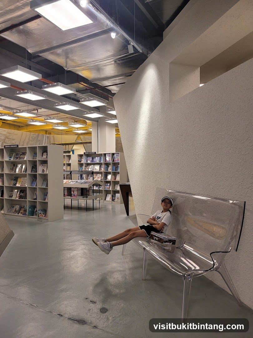 Child sitting on a clear bench in a bookstore