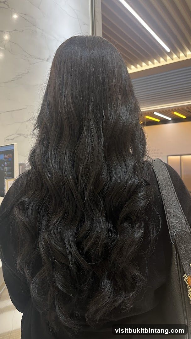 Woman with long, wavy dark hair