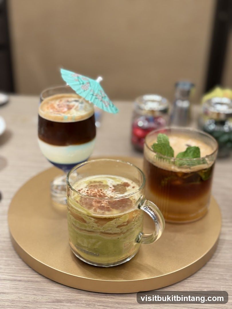 Three layered drinks on a tray