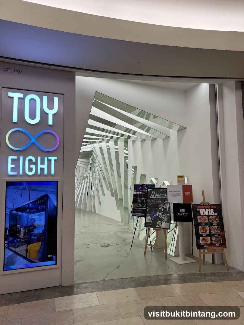 Entrance with mirrored art installation and promotional displays