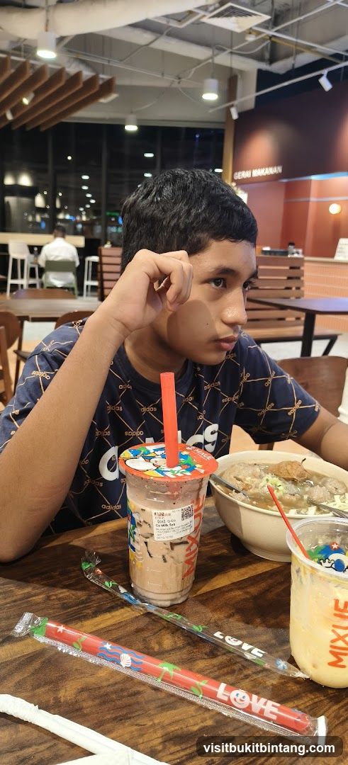 Boy with drinks and food