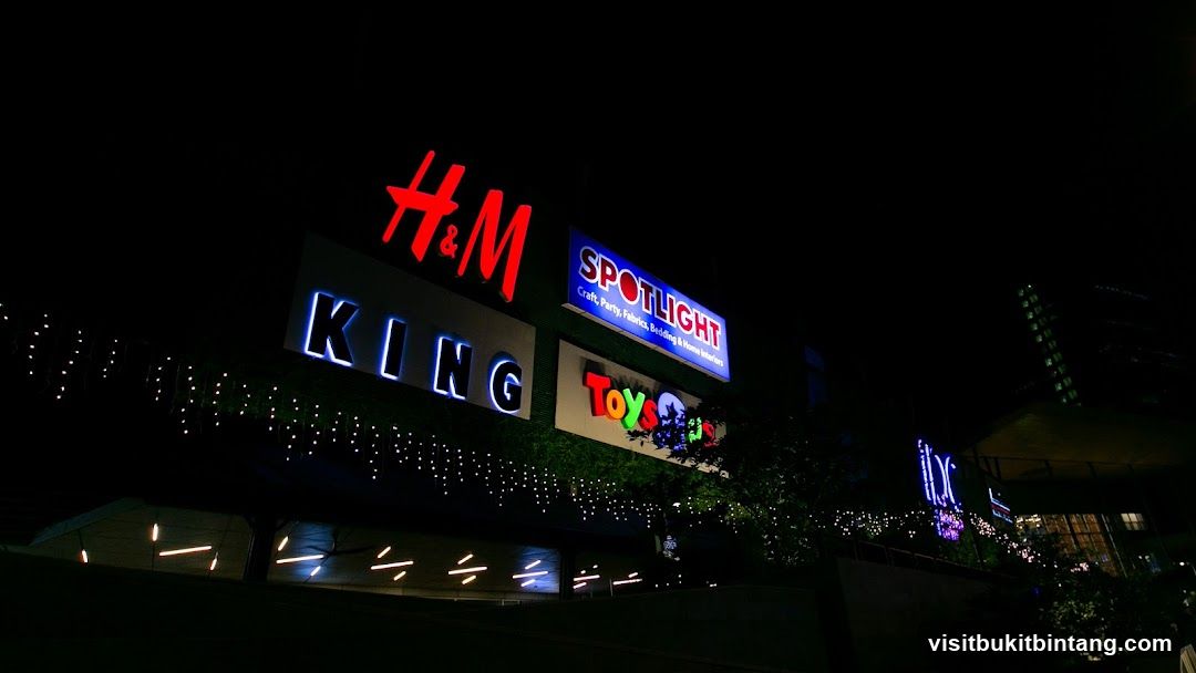 Nighttime view of illuminated store signs
