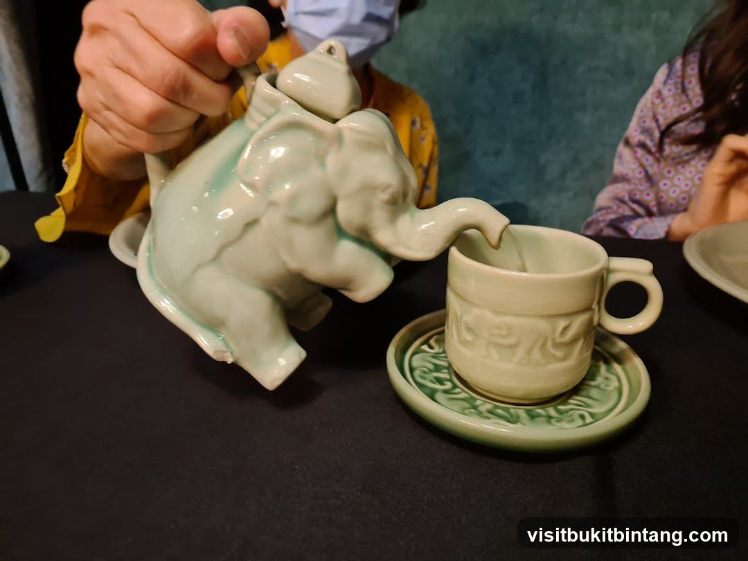 Elephant Teapot Pouring Tea