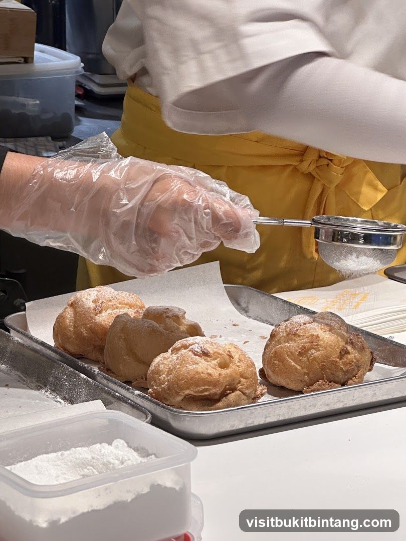Dusting Cream Puffs with Powdered Sugar