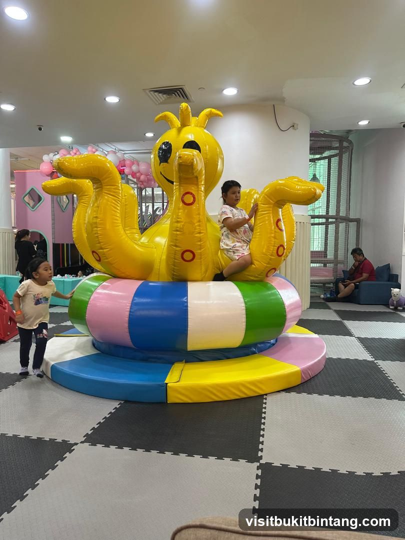 Children playing on an inflatable octopus