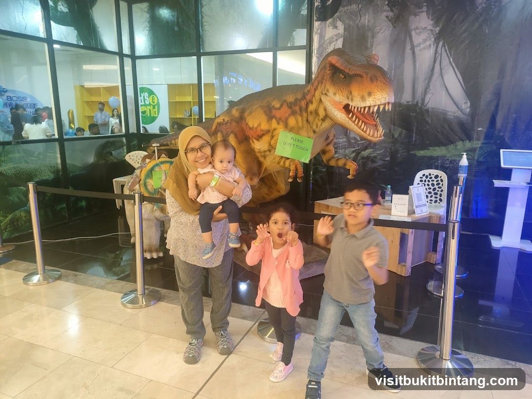 Family Poses with Dinosaur Exhibit