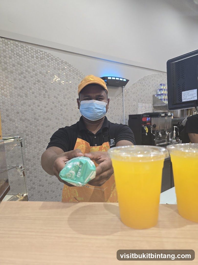 Staff member offering a food item