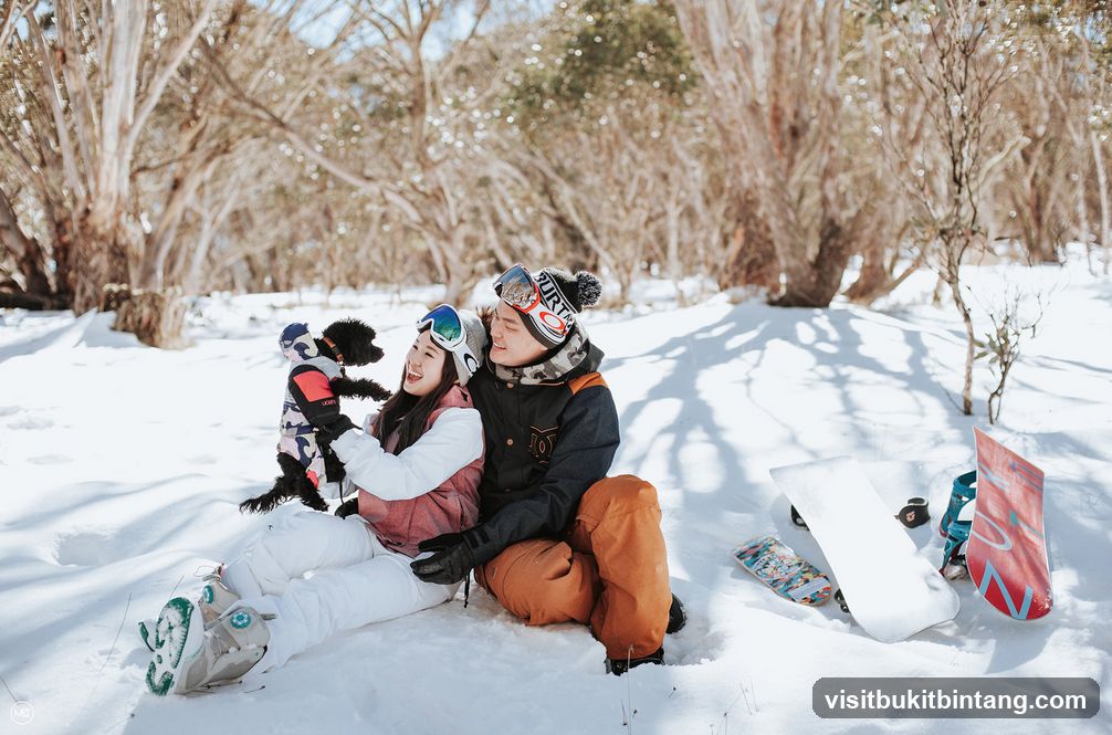 Couple with dog in snow