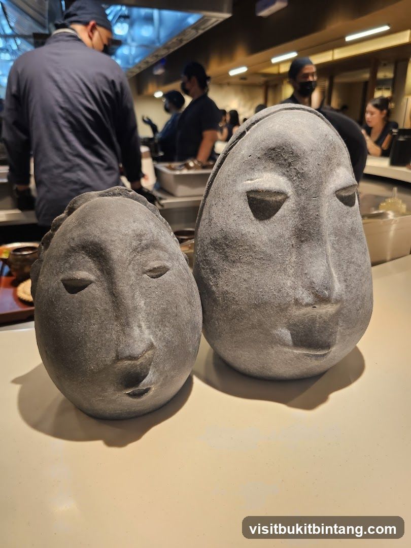 Stone Head Sculptures in Restaurant Kitchen