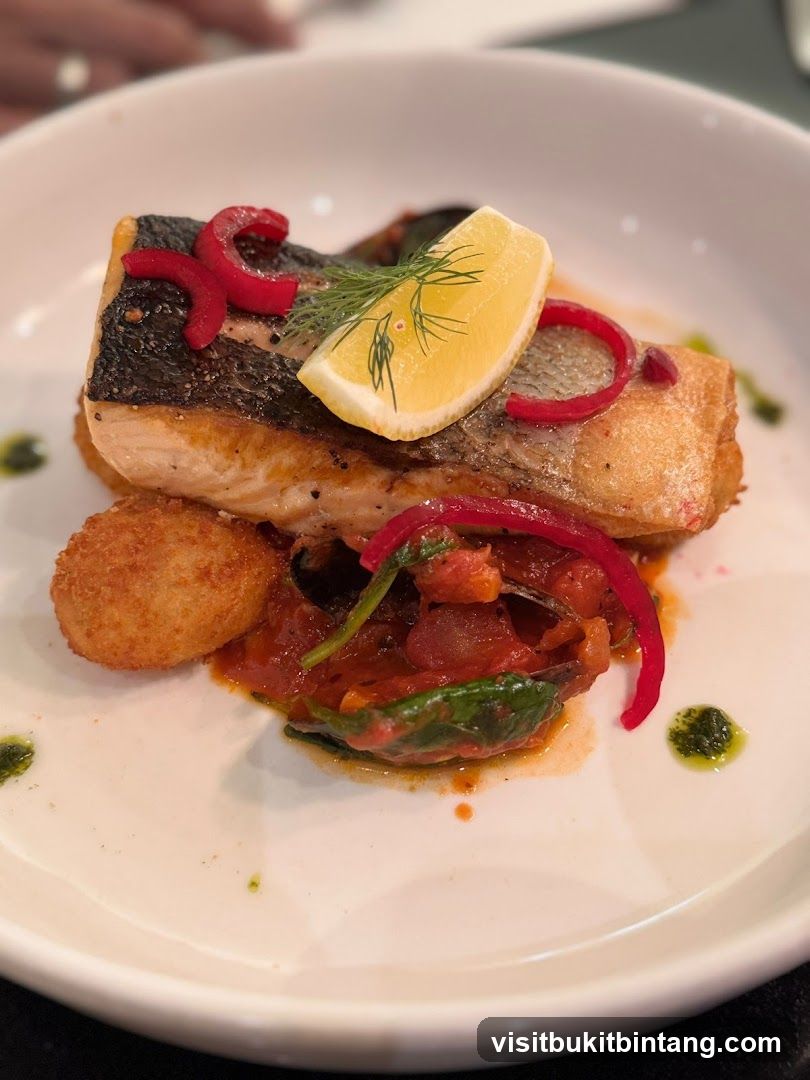 Salmon with lemon and red pepper garnish