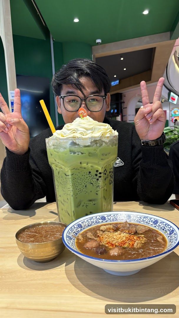 Man with Large Matcha Drink and Food