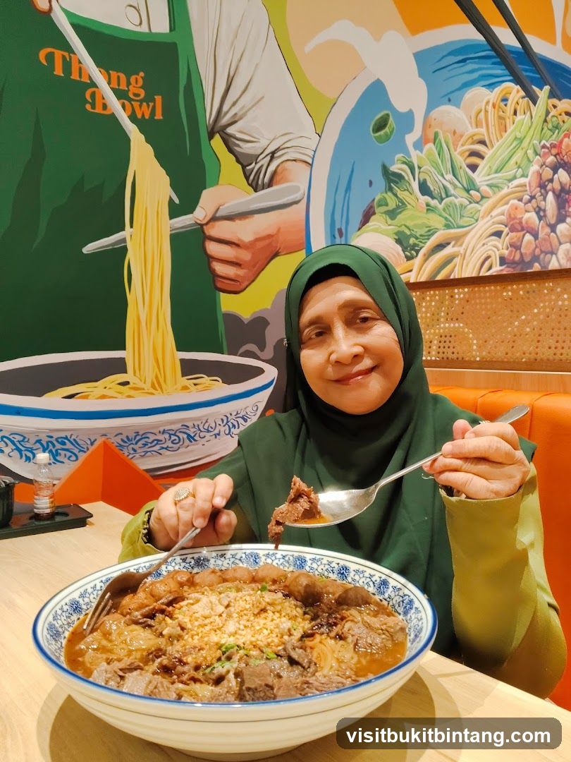 Woman Eating Beef Noodle Soup