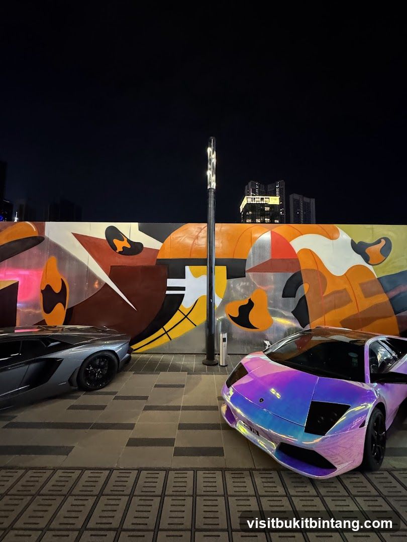 Luxury Cars Parked by Mural