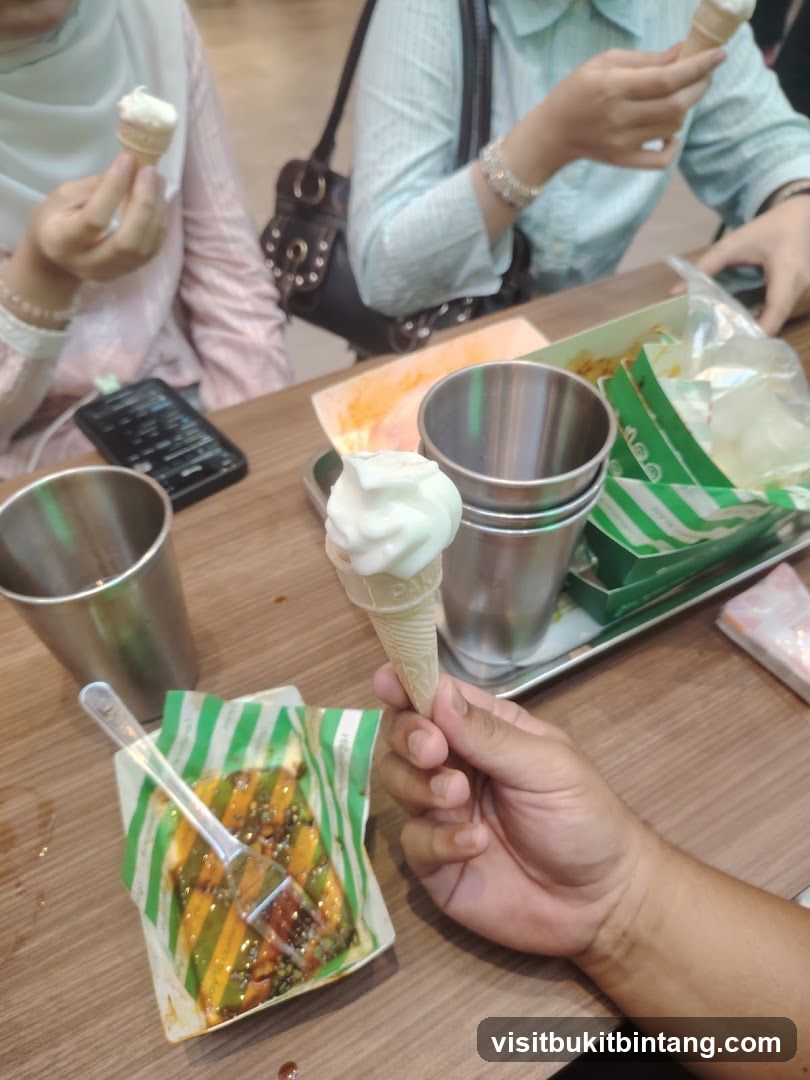 People enjoying ice cream cones and food