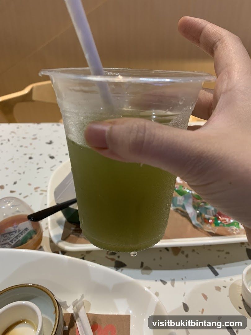 Green Drink in Plastic Cup