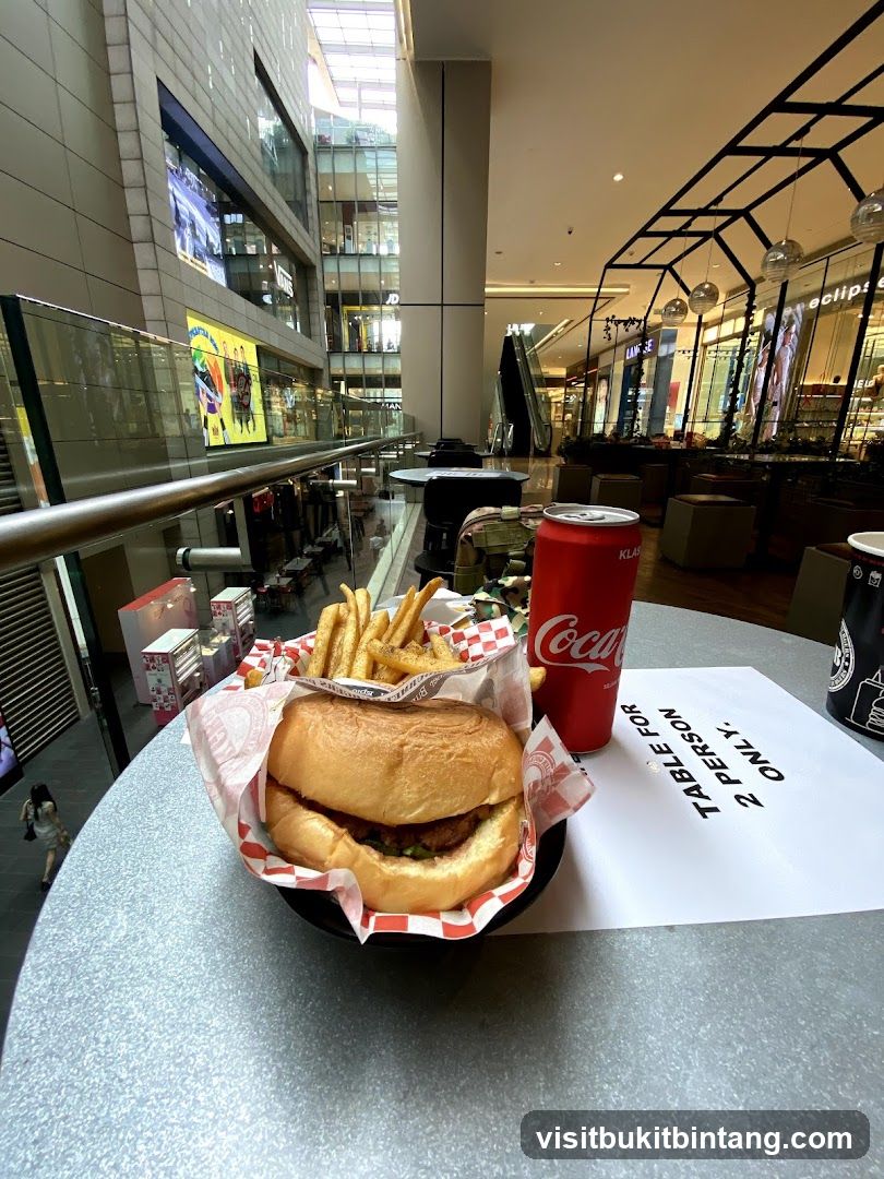 Burger, Fries, and Coca-Cola at a Table