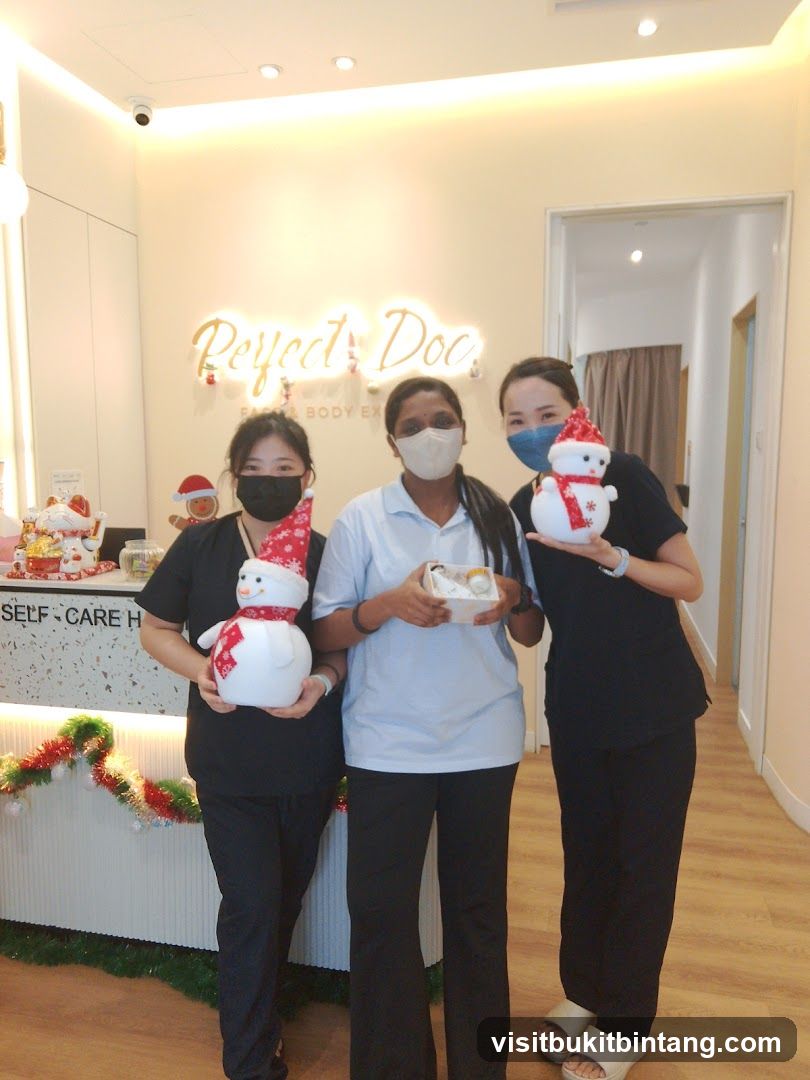 Staff holding Christmas decorations
