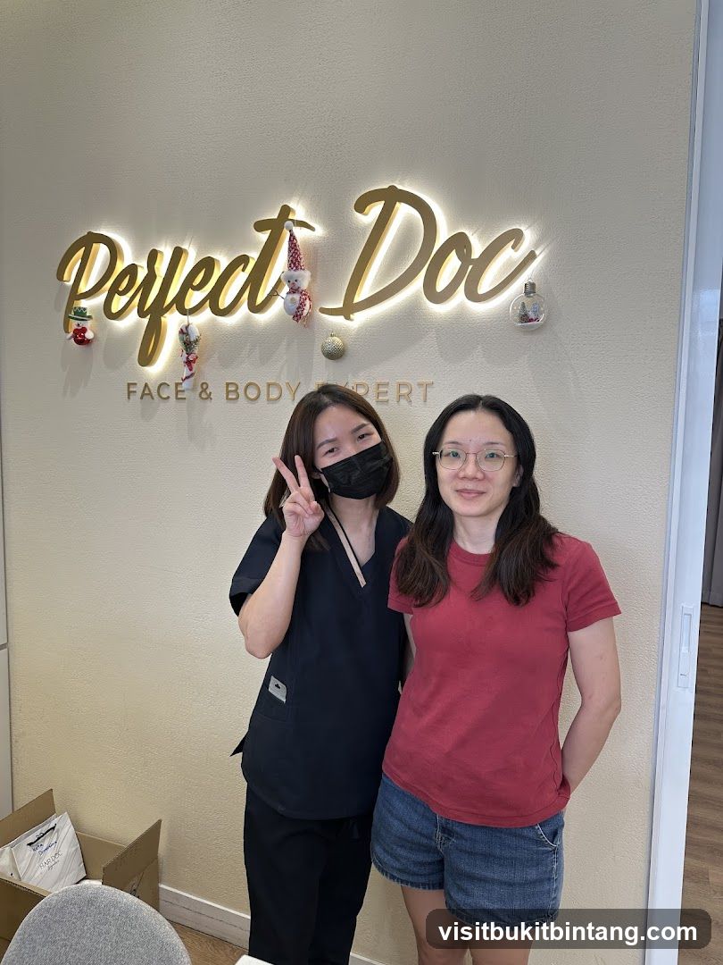Two Women Posing in Front of a Sign