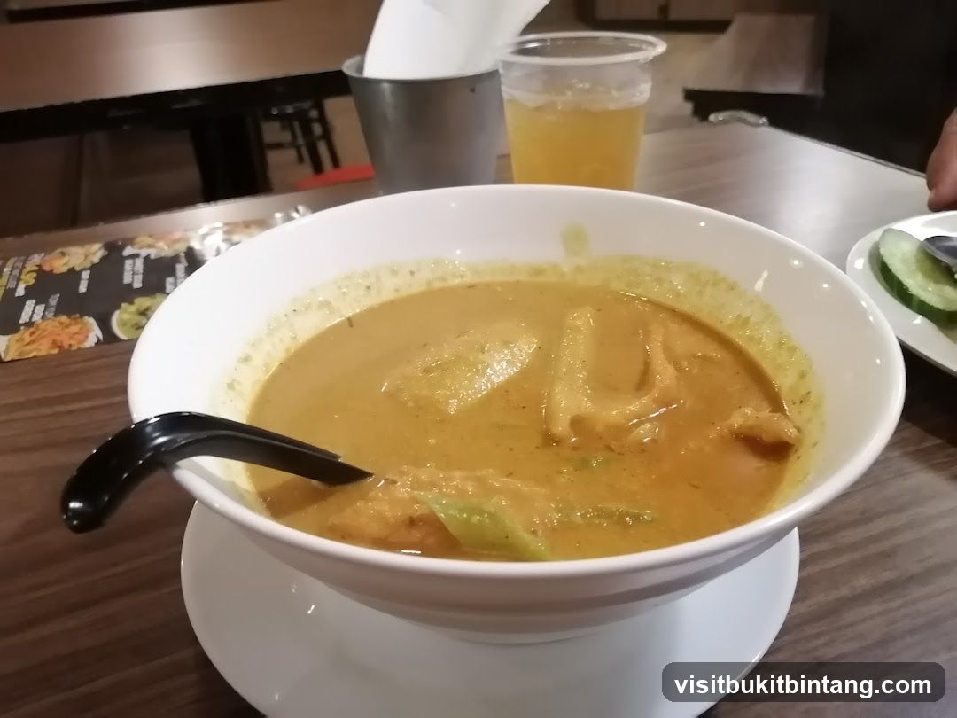 Curry dish with spoon and drink
