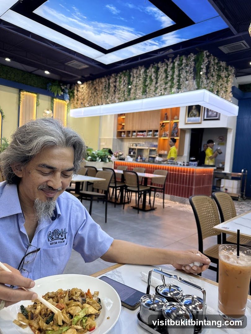Man Eating Noodles in Restaurant