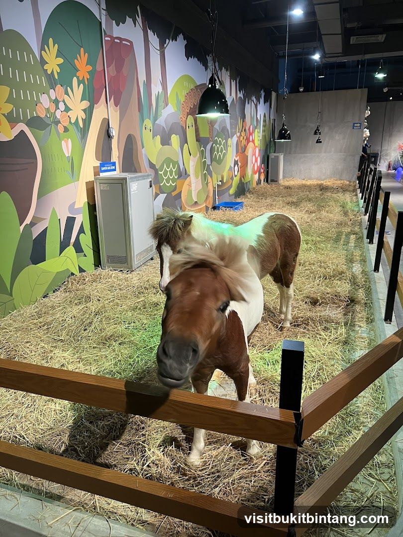 Pony enclosure with cartoon mural
