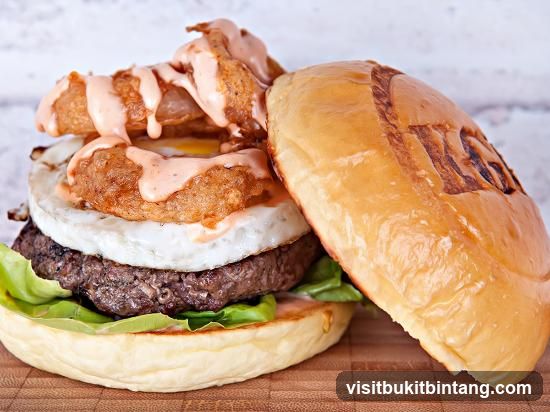 Burger with Onion Rings and Fried Egg
