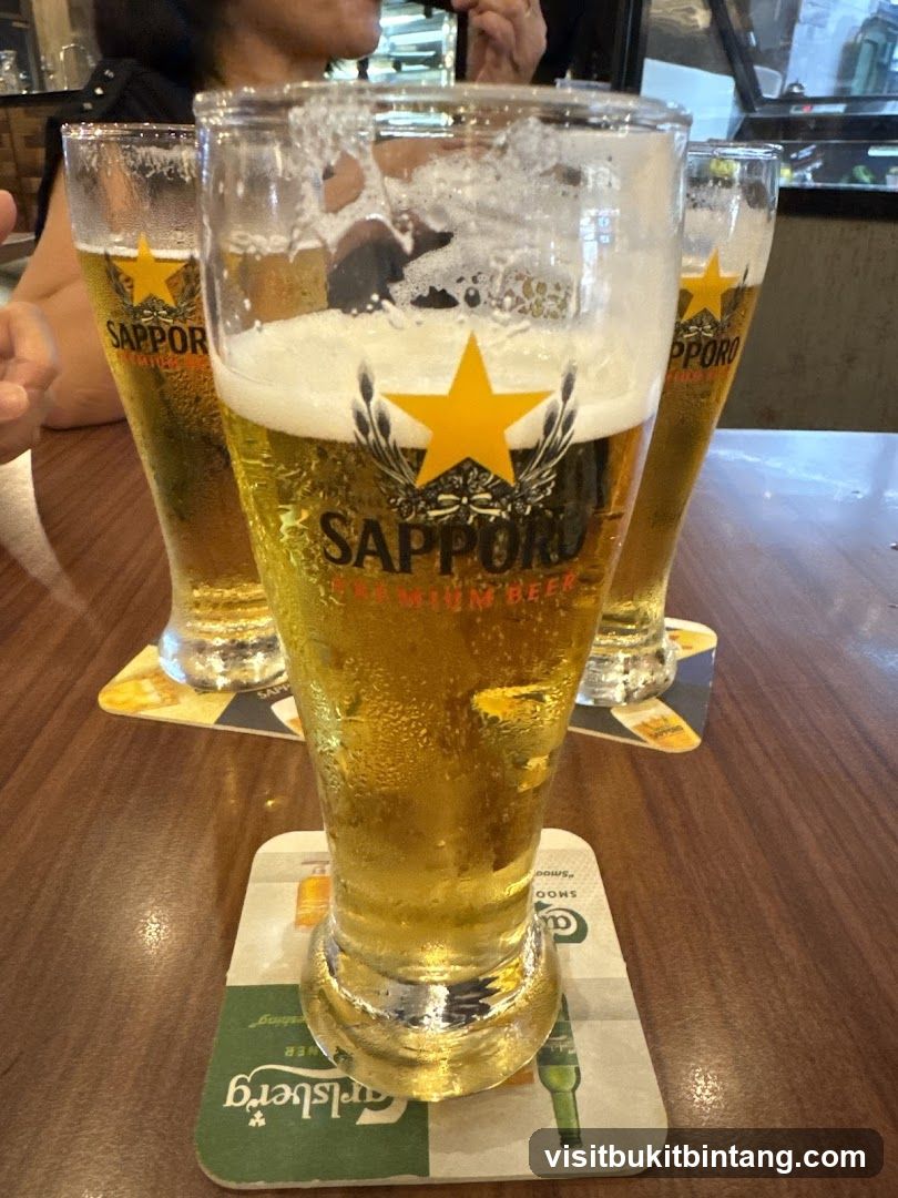 Three glasses of Sapporo beer