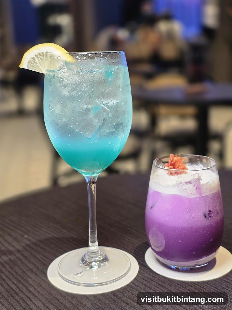 Two colorful cocktails on a table