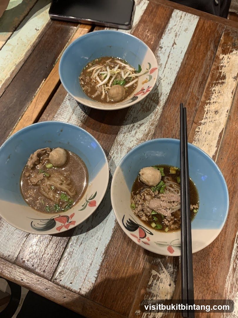 Three bowls of noodle soup