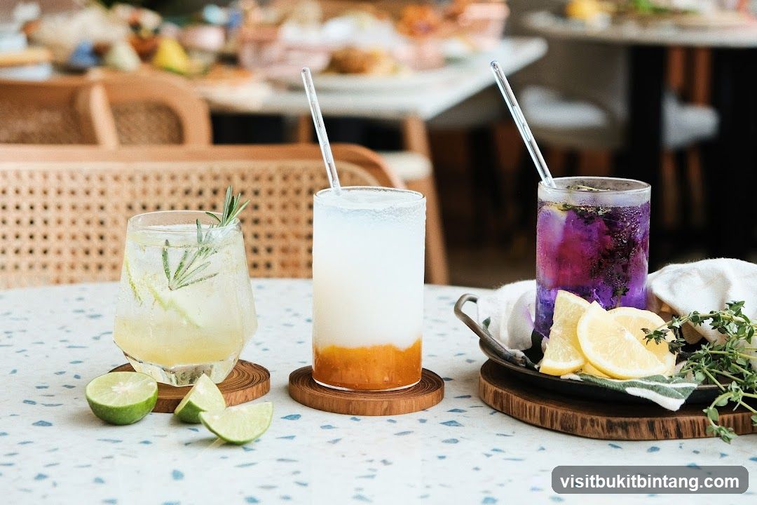 Three colorful drinks on a table