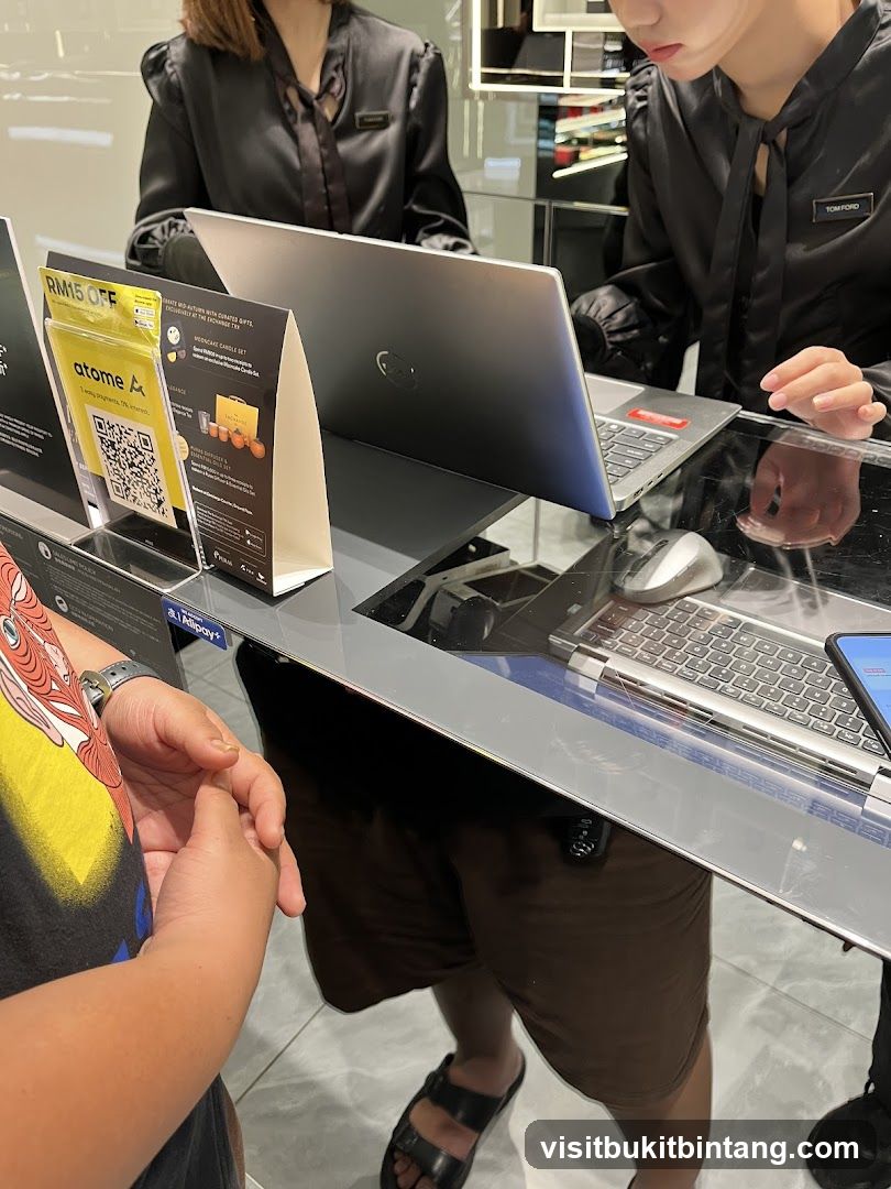 Retail Counter with Laptops and Promotional Display