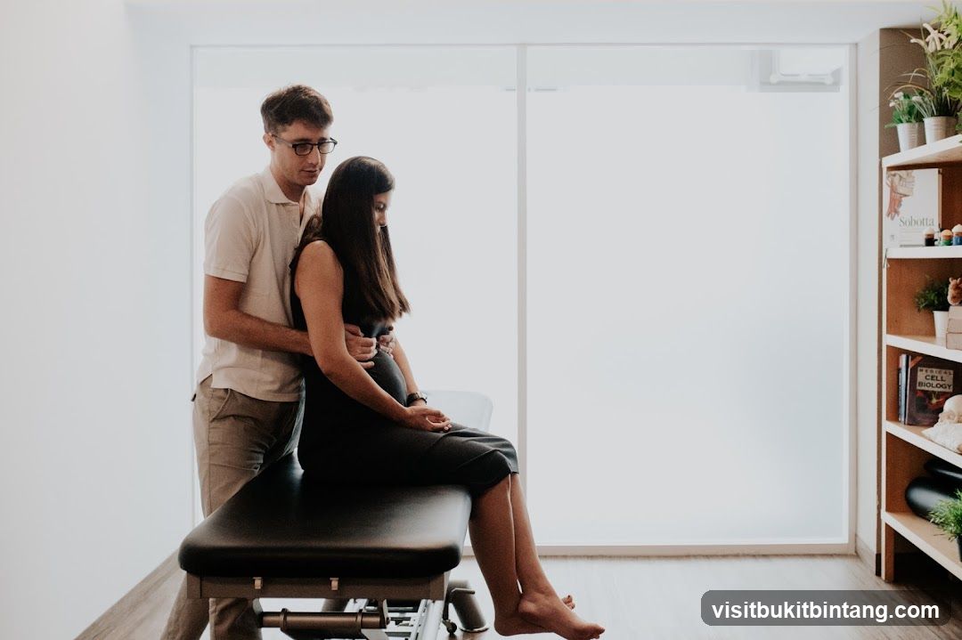 Therapist assisting a patient