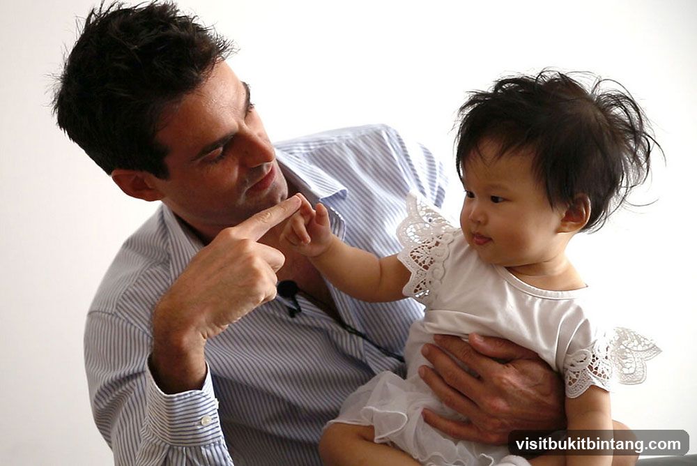 Man holding a baby