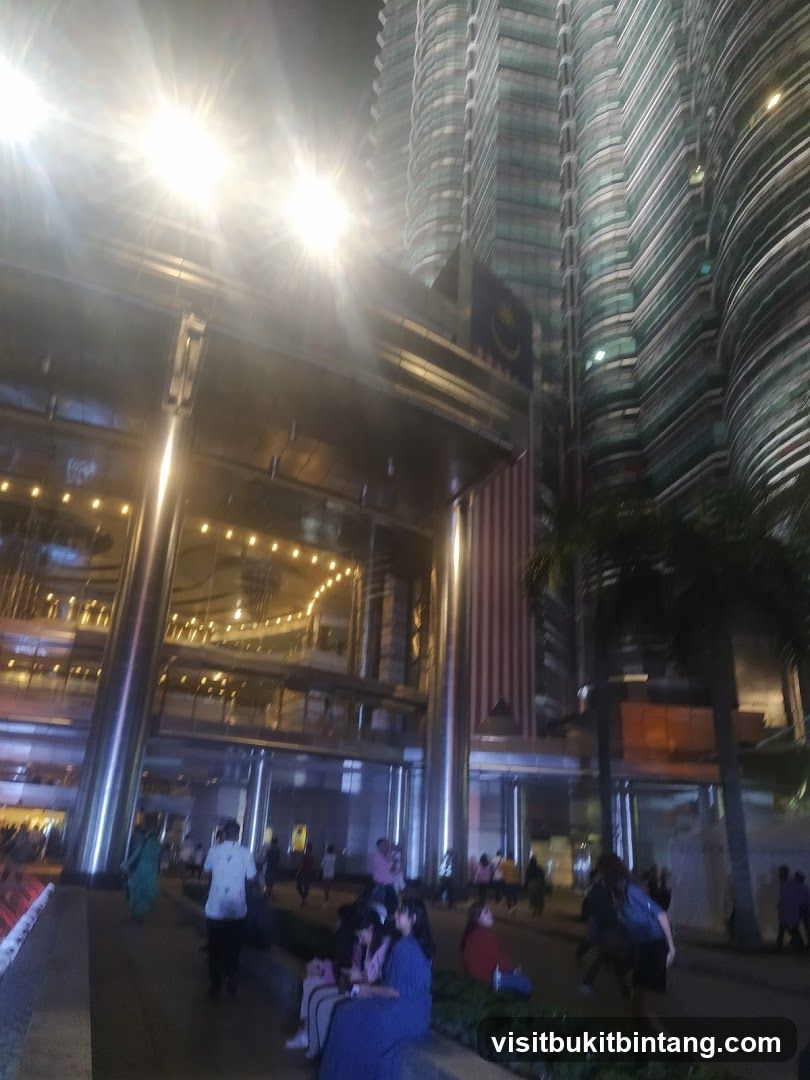 Nighttime view of a modern building with people