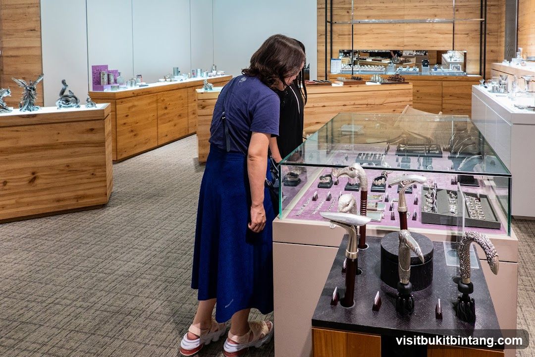 Customers browsing display cases in a store