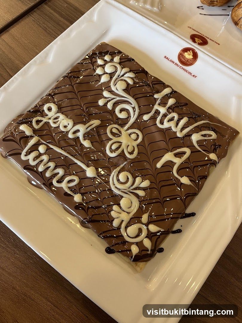 Chocolate Crepe with White Icing Decoration